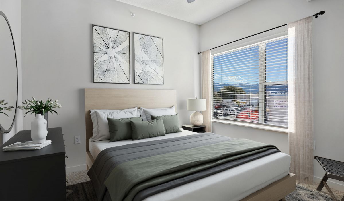 Contemporary bedroom with mountain views at The Whitney apartments in Salt Lake City, Utah